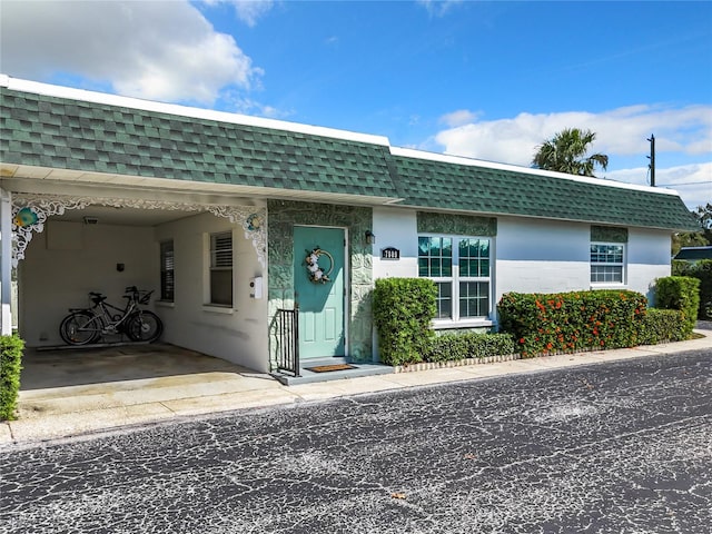 view of front of house with a carport