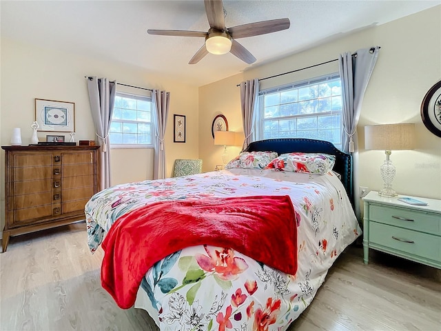 bedroom featuring ceiling fan and light hardwood / wood-style flooring