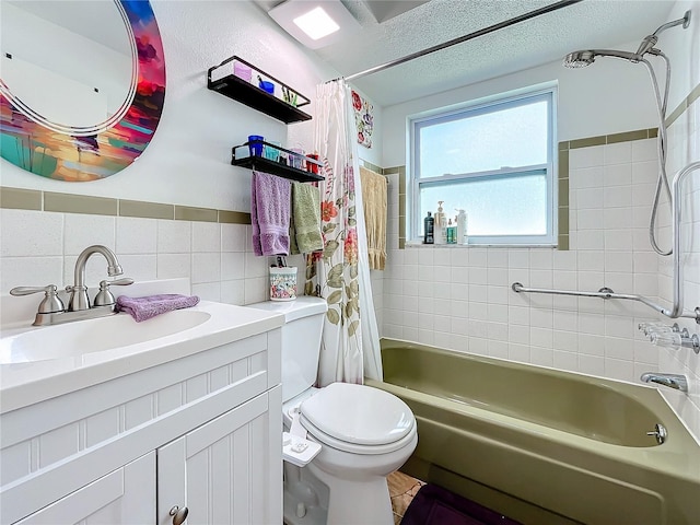 full bathroom featuring a textured ceiling, vanity, shower / bathtub combination with curtain, tile walls, and toilet