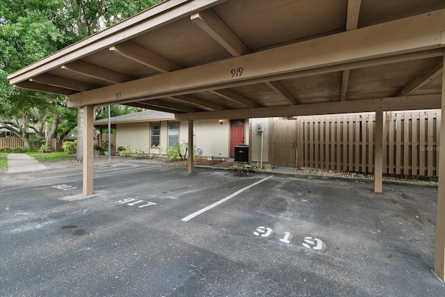 view of parking / parking lot with a carport