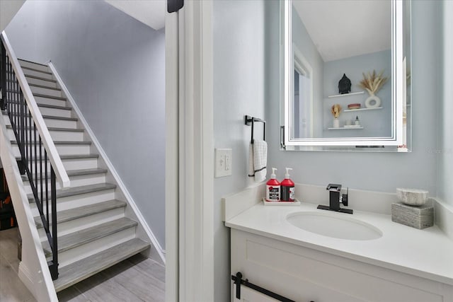 bathroom with vanity and hardwood / wood-style floors