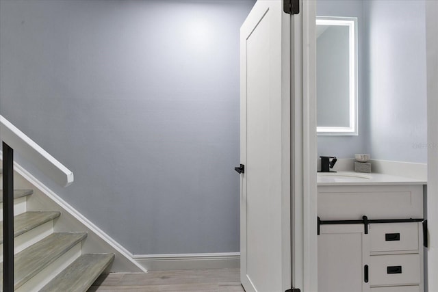 interior space featuring vanity and wood-type flooring