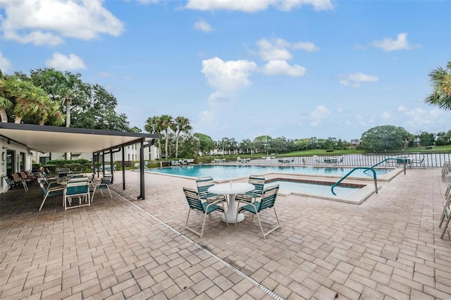 view of swimming pool with a patio area