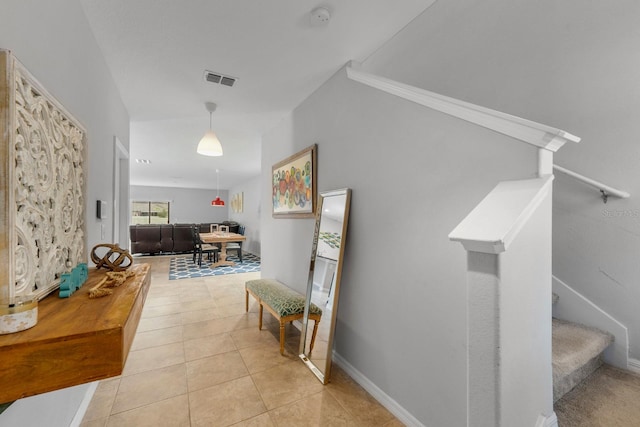 corridor featuring light tile patterned floors