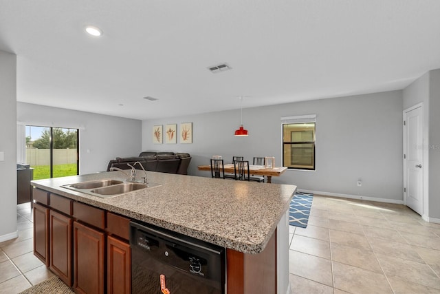 kitchen with dishwasher, sink, an island with sink, decorative light fixtures, and light tile patterned floors