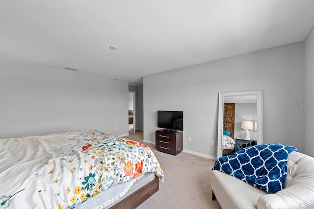 bedroom featuring light carpet