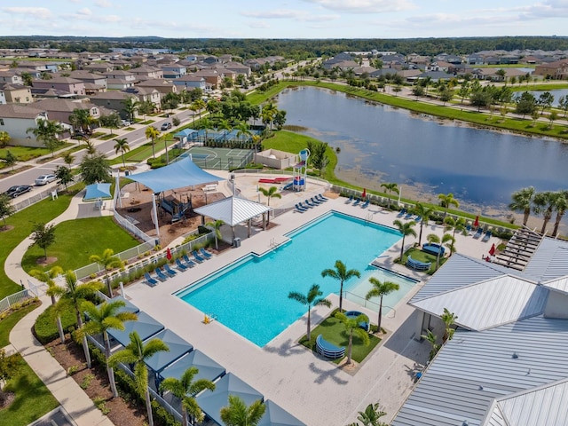 birds eye view of property with a water view