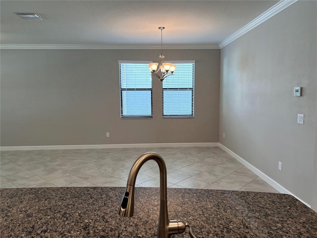 unfurnished dining area with ornamental molding and a notable chandelier