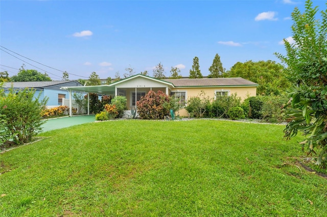 ranch-style house with a carport and a front yard