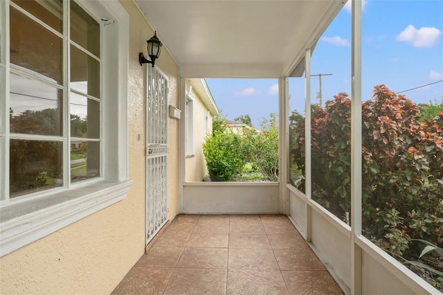 unfurnished sunroom with a wealth of natural light