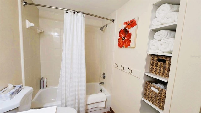 bathroom with shower / bath combo with shower curtain and toilet