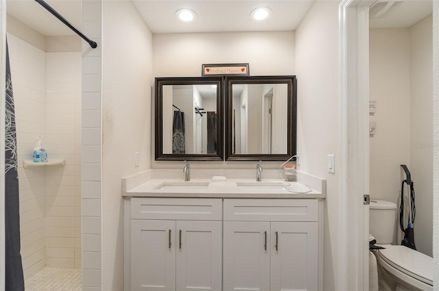 bathroom featuring vanity, toilet, and a shower with shower curtain