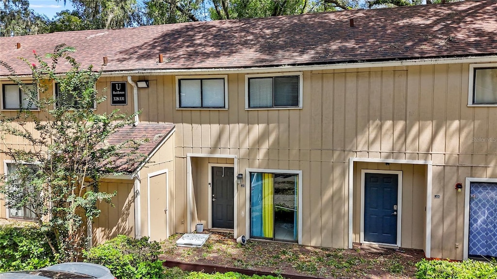 507 NW 39th Rd Unit 329, Gainesville, FL 32607 - view of front of property featuring a shingled roof