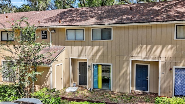 507 NW 39th Rd Unit 329, Gainesville, FL 32607 - view of front of property featuring a shingled roof