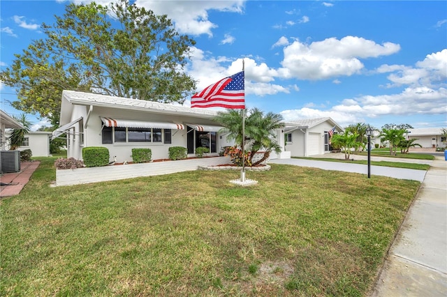 view of front of property featuring a front lawn and cooling unit