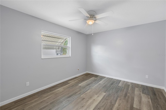 unfurnished room with hardwood / wood-style floors and ceiling fan