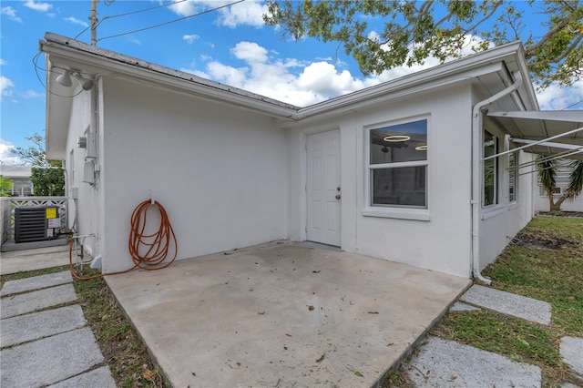 exterior space featuring a patio and central air condition unit