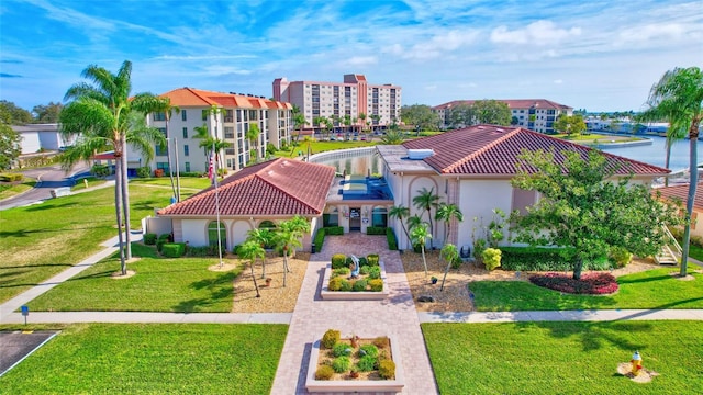 exterior space featuring a front yard and a water view