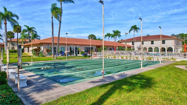 view of community featuring a yard