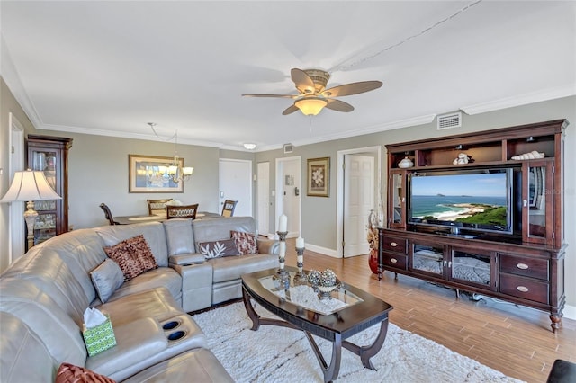 living room featuring light hardwood / wood-style flooring, ceiling fan with notable chandelier, and crown molding