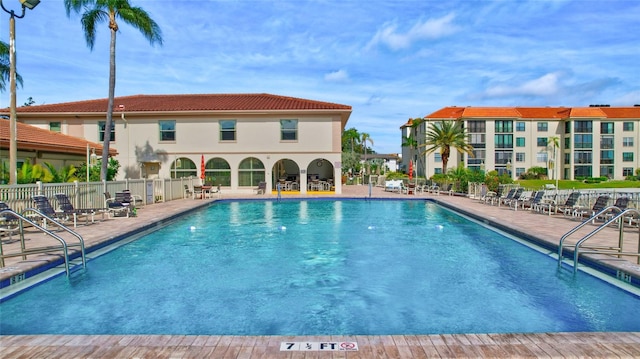 view of pool featuring a patio area