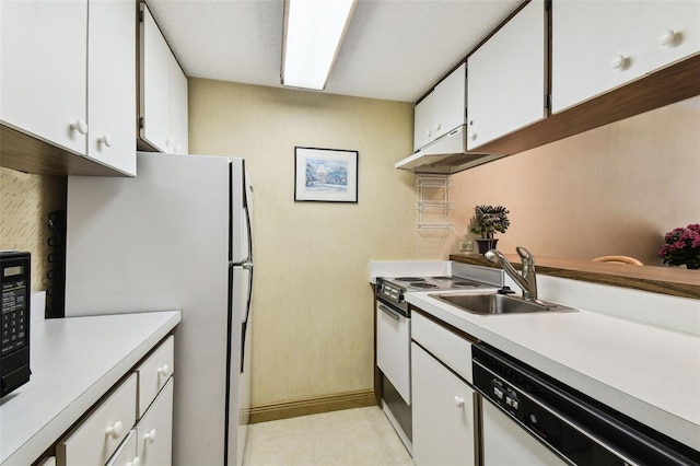 kitchen featuring light tile patterned floors, sink, white appliances, and white cabinetry