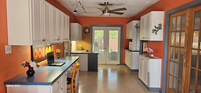 kitchen featuring ceiling fan, french doors, and white cabinets