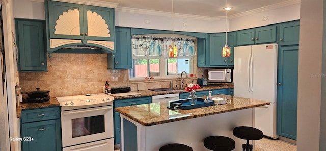 kitchen with pendant lighting, tasteful backsplash, a kitchen island, white appliances, and light stone countertops