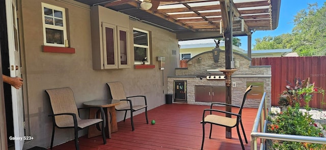 wooden deck featuring a pergola