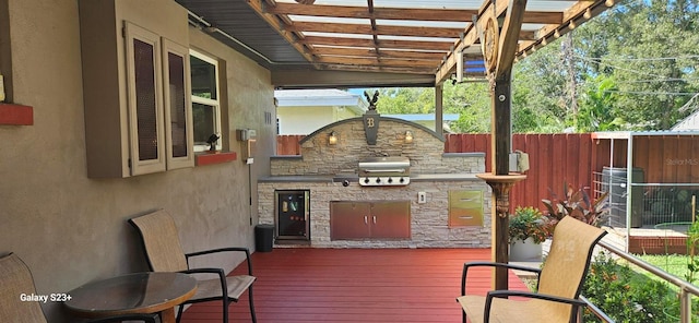 wooden deck featuring area for grilling