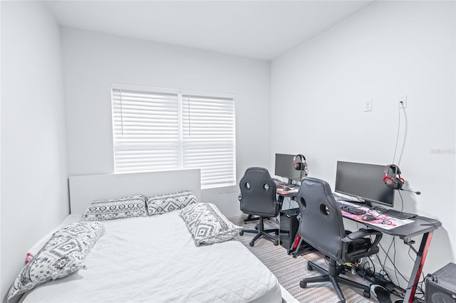 bedroom with hardwood / wood-style floors