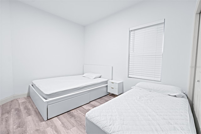 bedroom with light hardwood / wood-style floors