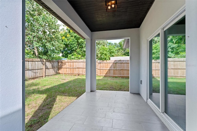 unfurnished sunroom with wood ceiling