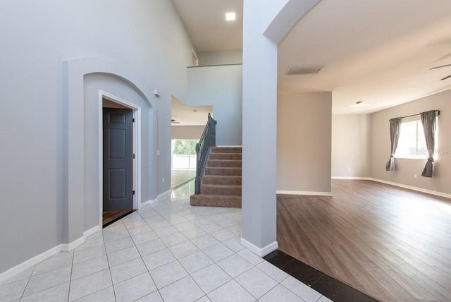 interior space with light hardwood / wood-style floors, plenty of natural light, and ceiling fan