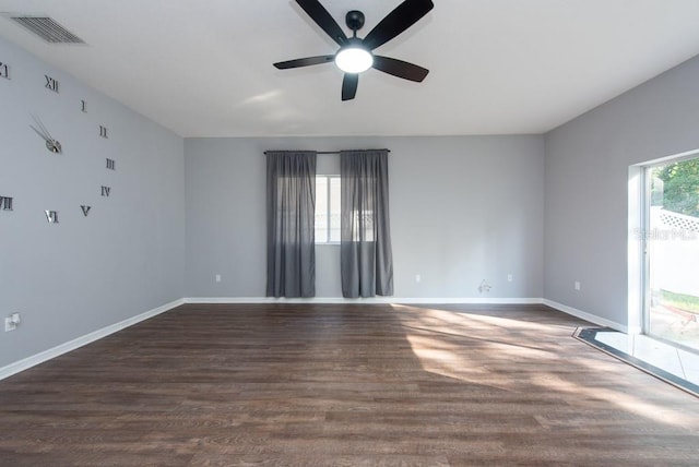 unfurnished room featuring dark hardwood / wood-style flooring and ceiling fan