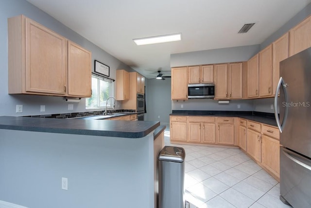 kitchen featuring light brown cabinetry, kitchen peninsula, appliances with stainless steel finishes, and ceiling fan