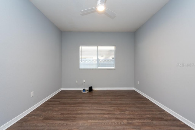 unfurnished room with ceiling fan and dark hardwood / wood-style floors