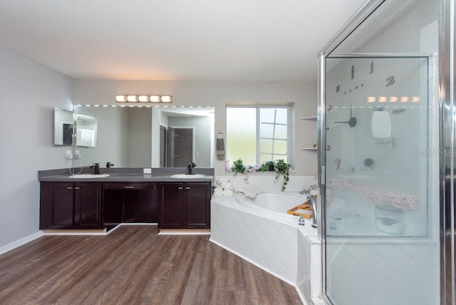 bathroom featuring vanity, shower with separate bathtub, and wood-type flooring