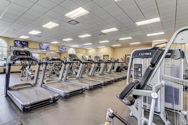 exercise room featuring a paneled ceiling