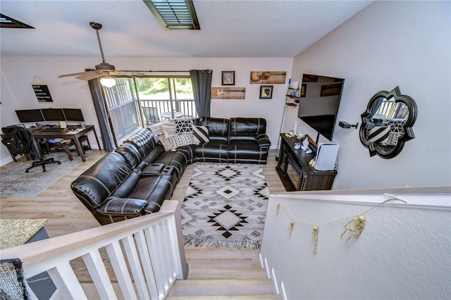 living room with ceiling fan and light wood-type flooring