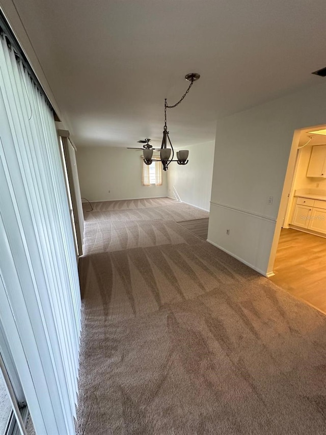 unfurnished dining area featuring carpet