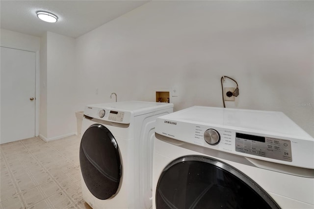 clothes washing area featuring washing machine and dryer