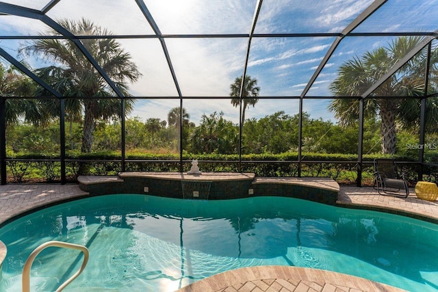 view of pool featuring a lanai and a patio area