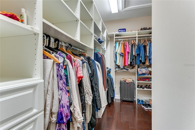 walk in closet featuring dark hardwood / wood-style flooring