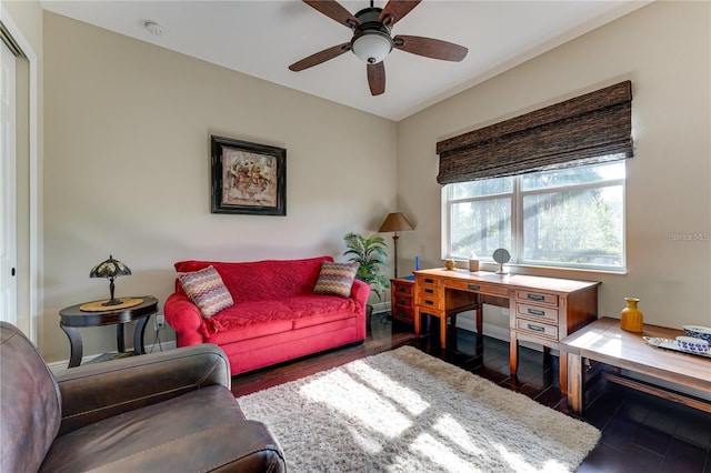 living room with dark hardwood / wood-style floors and ceiling fan