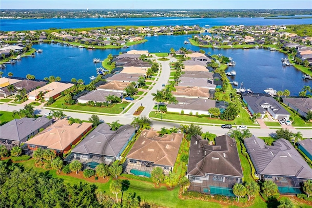 birds eye view of property with a water view