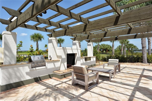 view of patio featuring area for grilling, grilling area, and a pergola