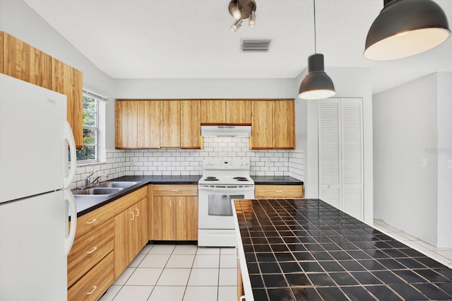 kitchen featuring backsplash, white appliances, sink, pendant lighting, and light tile patterned floors