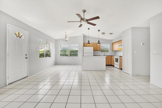 kitchen featuring white appliances, tasteful backsplash, vaulted ceiling, and light tile patterned flooring