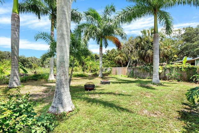 view of yard with an outdoor fire pit